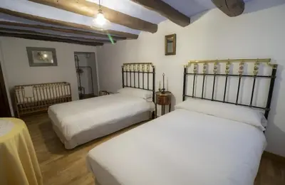 Cama o camas de una habitación en Casa rural Casa Leles