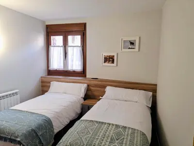 Cama o camas de una habitación en Apartamentos Casa Domec