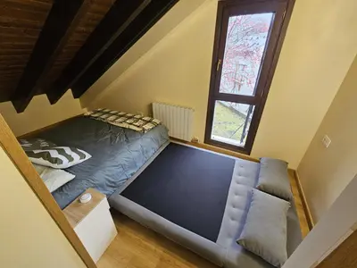 Cama o camas de una habitación en El Rincón de Escarrilla