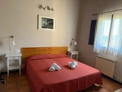 Cama o camas de una habitación en Apartahotel Valle de Rodellar