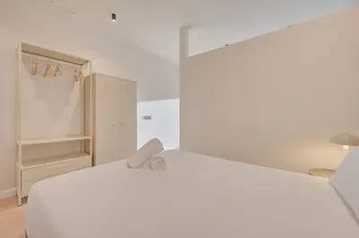Cama o camas de una habitación en Parque central B by Clabao