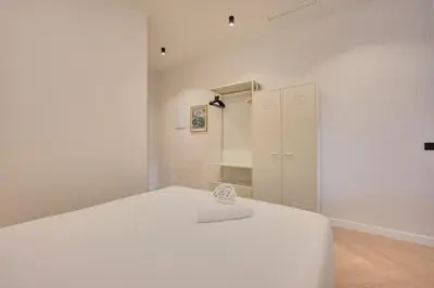 Cama o camas de una habitación en Parque central A by Clabao