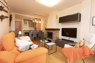 Una televisión o centro de entretenimiento en Cota de la marmota by CARDI Suites