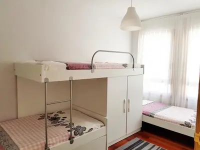 Cama o camas de una habitación en Vivienda Turística Pirineos XXI