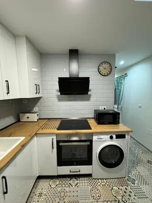 Una cocina o zona de cocina en Apartamento El Alfar
