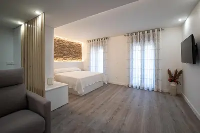 Cama o camas de una habitación en Apartamentos Bombón Tudela