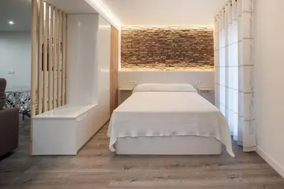 Cama o camas de una habitación en Apartamentos Bombón Tudela