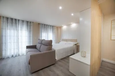 Cama o camas de una habitación en Apartamentos Bombón Tudela