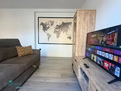 Una televisión o centro de entretenimiento en Dos Torres Las Canteras