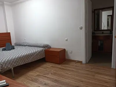 Cama o camas de una habitación en Apartamento en el centro encima de piscina Palafox