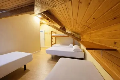 Cama o camas de una habitación en Albergue Pájaro L