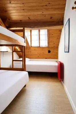 Cama o camas de una habitación en Albergue Pájaro L