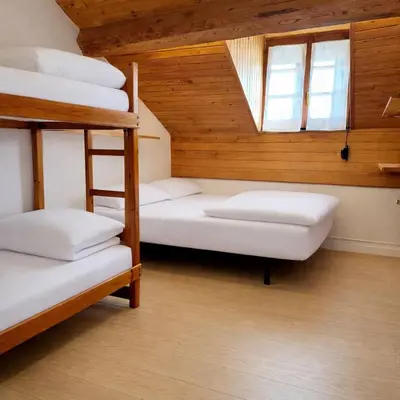 Cama o camas de una habitación en Albergue Pájaro L