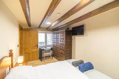 Cama o camas de una habitación en Acogedora casa rural para conocer Navarra