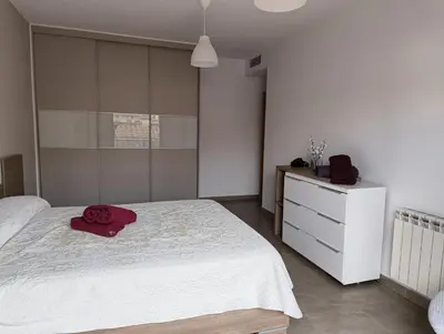 Cama o camas de una habitación en Apartamentos La Aubaga