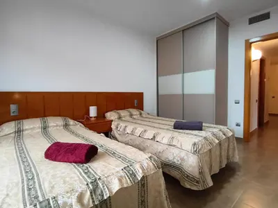 Cama o camas de una habitación en Apartamentos La Aubaga