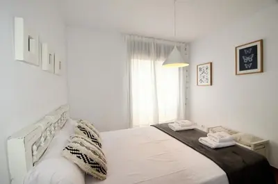 Cama o camas de una habitación en Apartaments la Rambla - L'Arrel - 4 persones