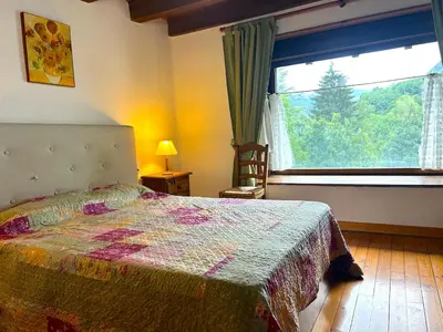 Cama o camas de una habitación en Casa rústica y patio en la Vall d'Aran by RURAL D'ÀNEU