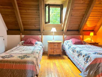 Cama o camas de una habitación en Casa rústica y patio en la Vall d'Aran by RURAL D'ÀNEU