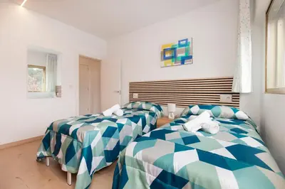 Cama o camas de una habitación en El rincón de las Delicias