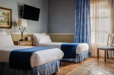 Cama o camas de una habitación en hotel os de civis