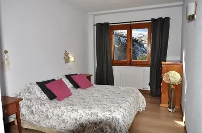 Cama o camas de una habitación en Apartamentos Tirol