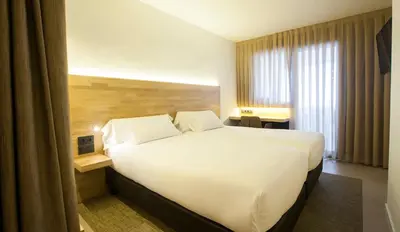 Cama o camas de una habitación en Hotel A Pamplona