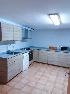 Una cocina o zona de cocina en El Jardí Casa rural ideal para familias y grupos
