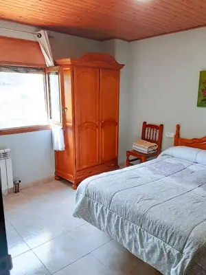 Cama o camas de una habitación en El Jardí Casa rural ideal para familias y grupos