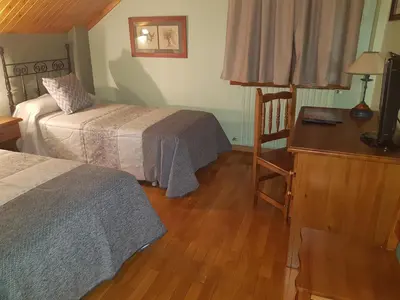 Cama o camas de una habitación en Aparta-Hotel Puertolas