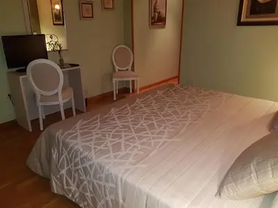 Cama o camas de una habitación en Aparta-Hotel Puertolas