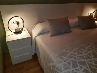 Cama o camas de una habitación en Aparta-Hotel Puertolas