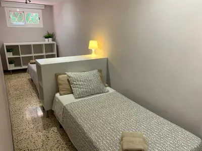 Cama o camas de una habitación en Apartamentos Caspe