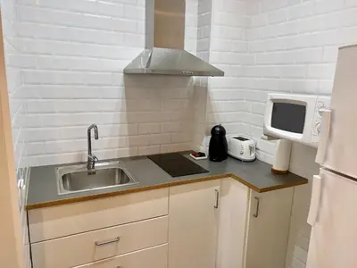 Una cocina o zona de cocina en Apartamentos Caspe