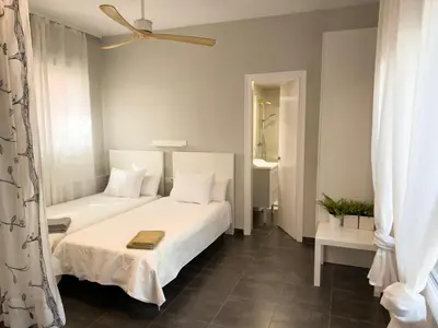 Cama o camas de una habitación en Apartamentos Caspe