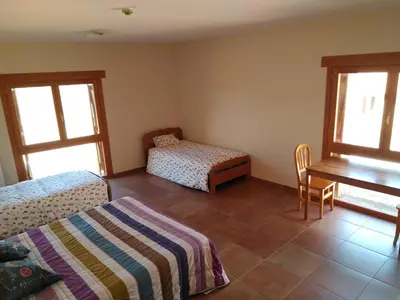 Cama o camas de una habitación en Albergue Casa Salinas