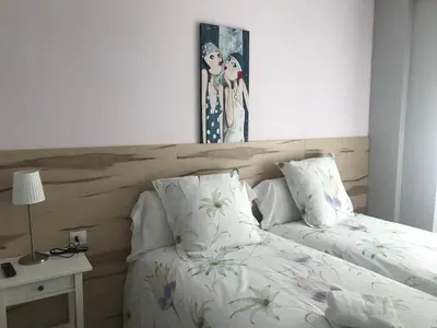 Cama o camas de una habitación en Alojamientos Olga