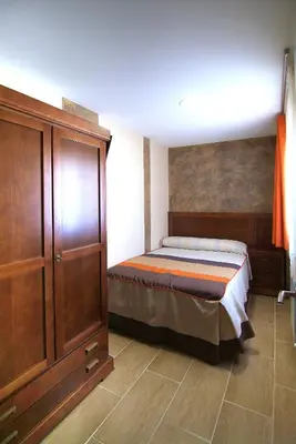 Cama o camas de una habitación en Apartahotel La Corrala