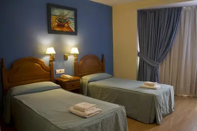 Cama o camas de una habitación en Hotel Clemente