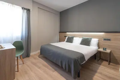 Cama o camas de una habitación en Alda Centro Pamplona