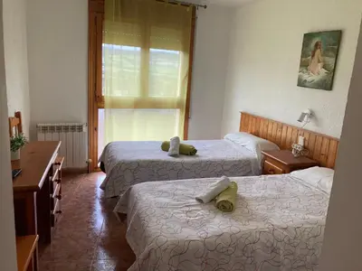 Cama o camas de una habitación en Montrebei Casa González Apartamentos