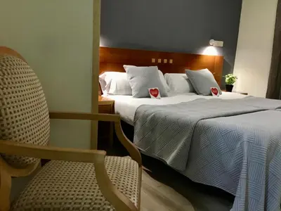 Cama o camas de una habitación en Hotel Paris Centro