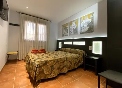 Cama o camas de una habitación en Apartamentos de turismo rural Las Eras