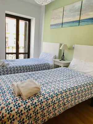 Cama o camas de una habitación en Apartamentos Zaragoza Coso