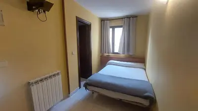 Cama o camas de una habitación en Hostal Rural Sositana