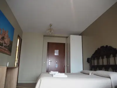Cama o camas de una habitación en Hostal Acella