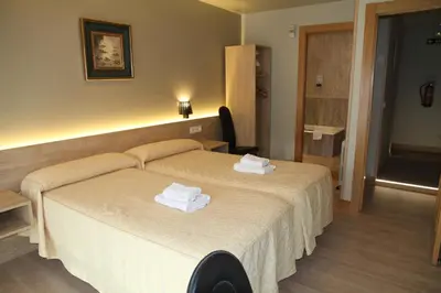 Cama o camas de una habitación en Hostal Acella