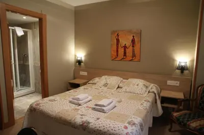 Cama o camas de una habitación en Hostal Acella