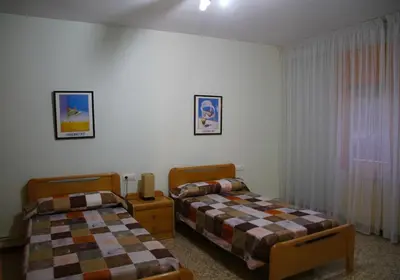 Cama o camas de una habitación en CASA LA FÀBRICA