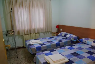 Cama o camas de una habitación en CASA LA FÀBRICA
